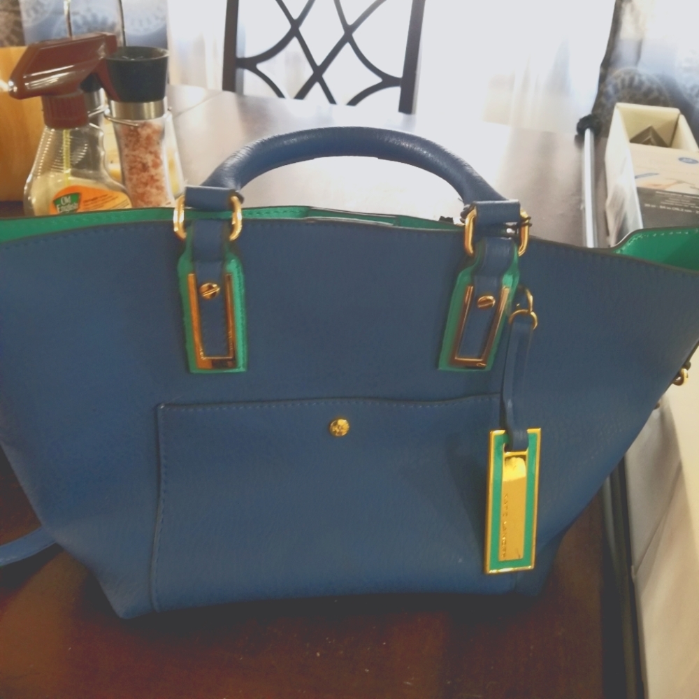 Kate lanbry blue and turquoise crossbody hand bag.  Removable strap great shape.